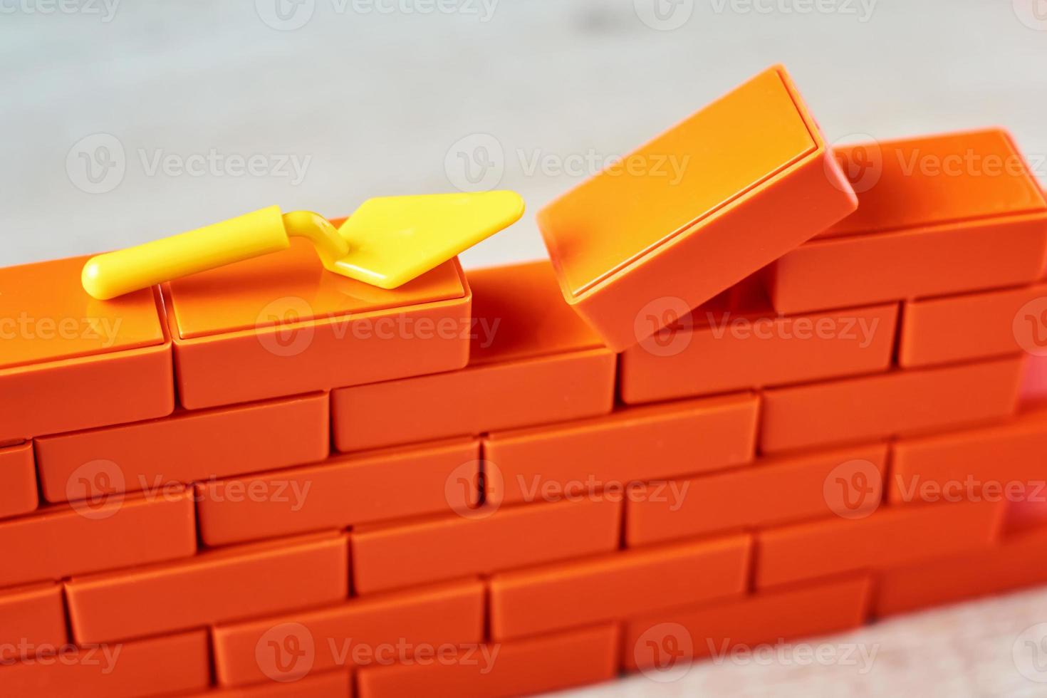 Last brick in brickwork. Task Completion Concept photo