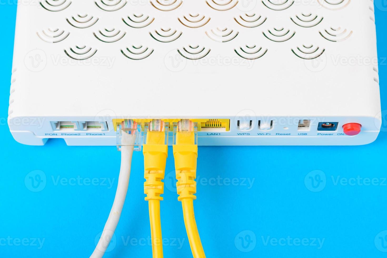 internet modem router hub with a cable connecting on blue background photo