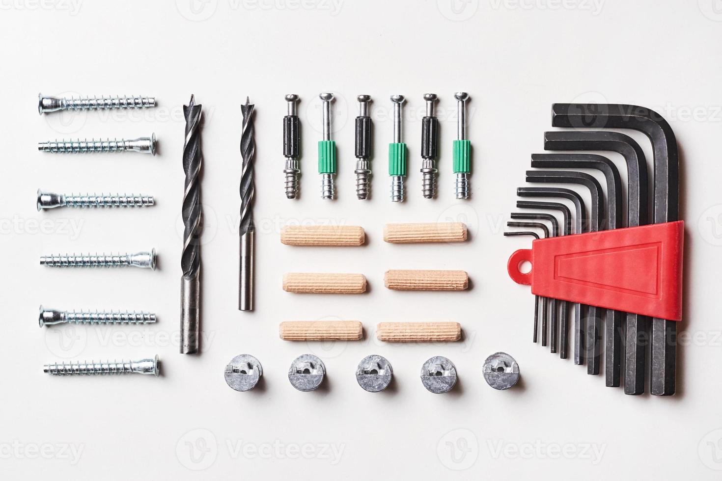Tools for furniture assembly on a white background for mock up template design. View from above. Flat lay photo