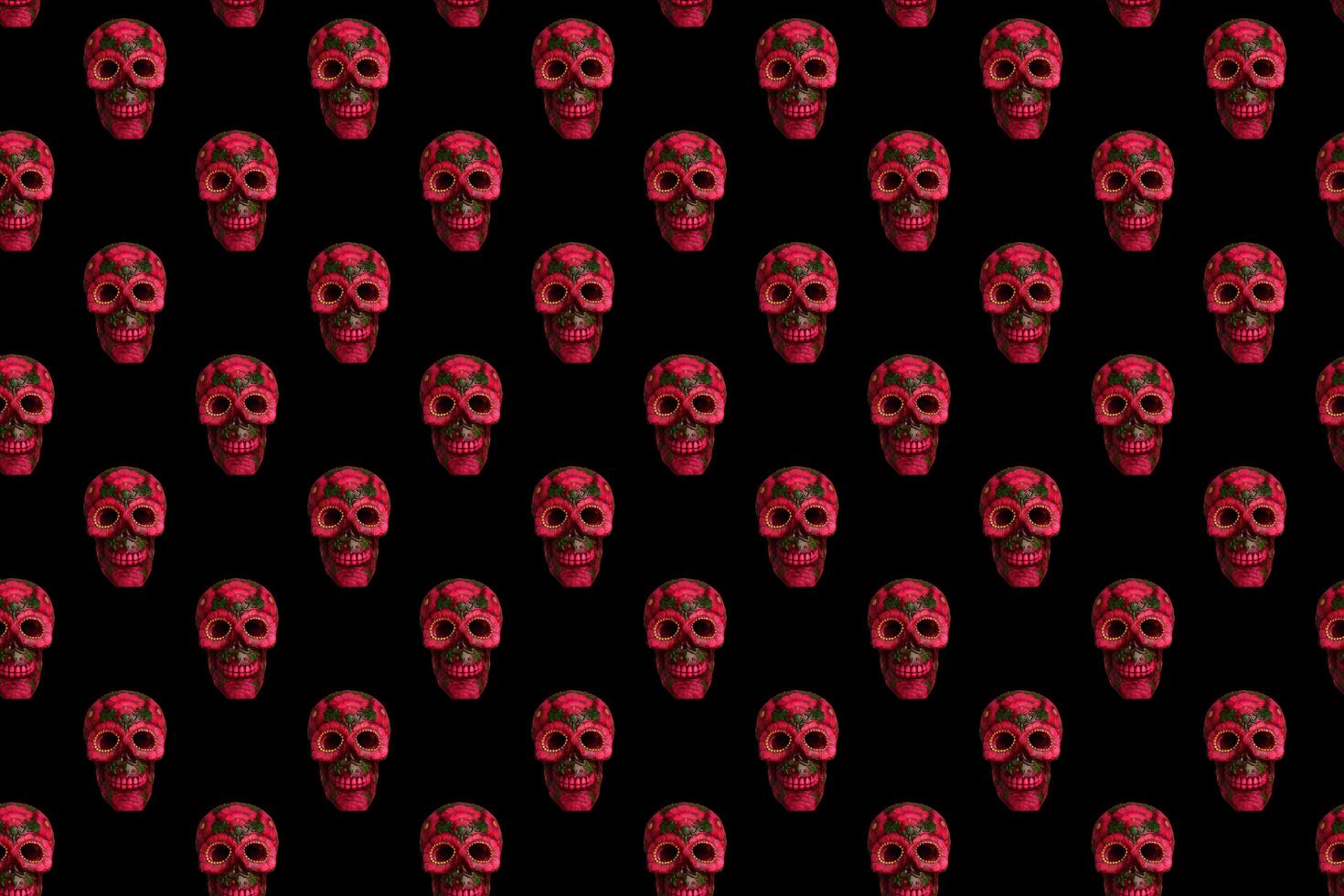 Seamless pattern from black skull with flowers on black background. photo