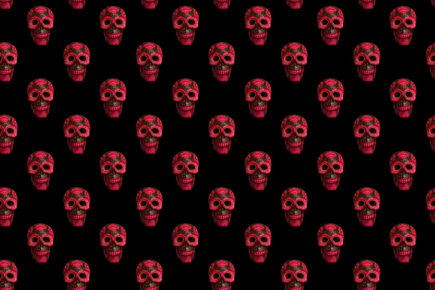 Seamless pattern from black skull with flowers on black background. photo