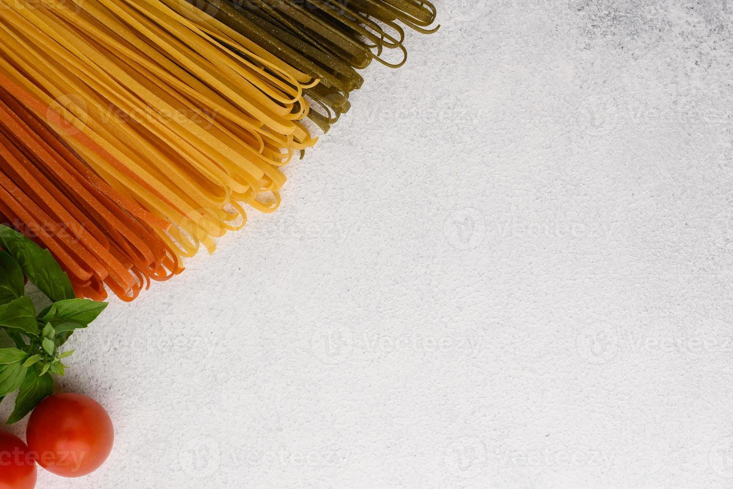 Vegetarian pasta ingredients border top view. Copy space. photo