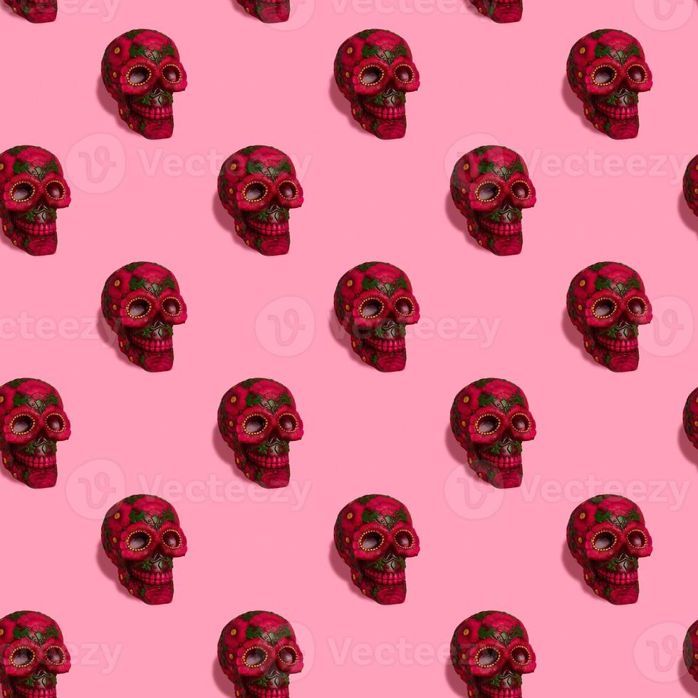 Square seamless background pattern from black skull with flowers. photo