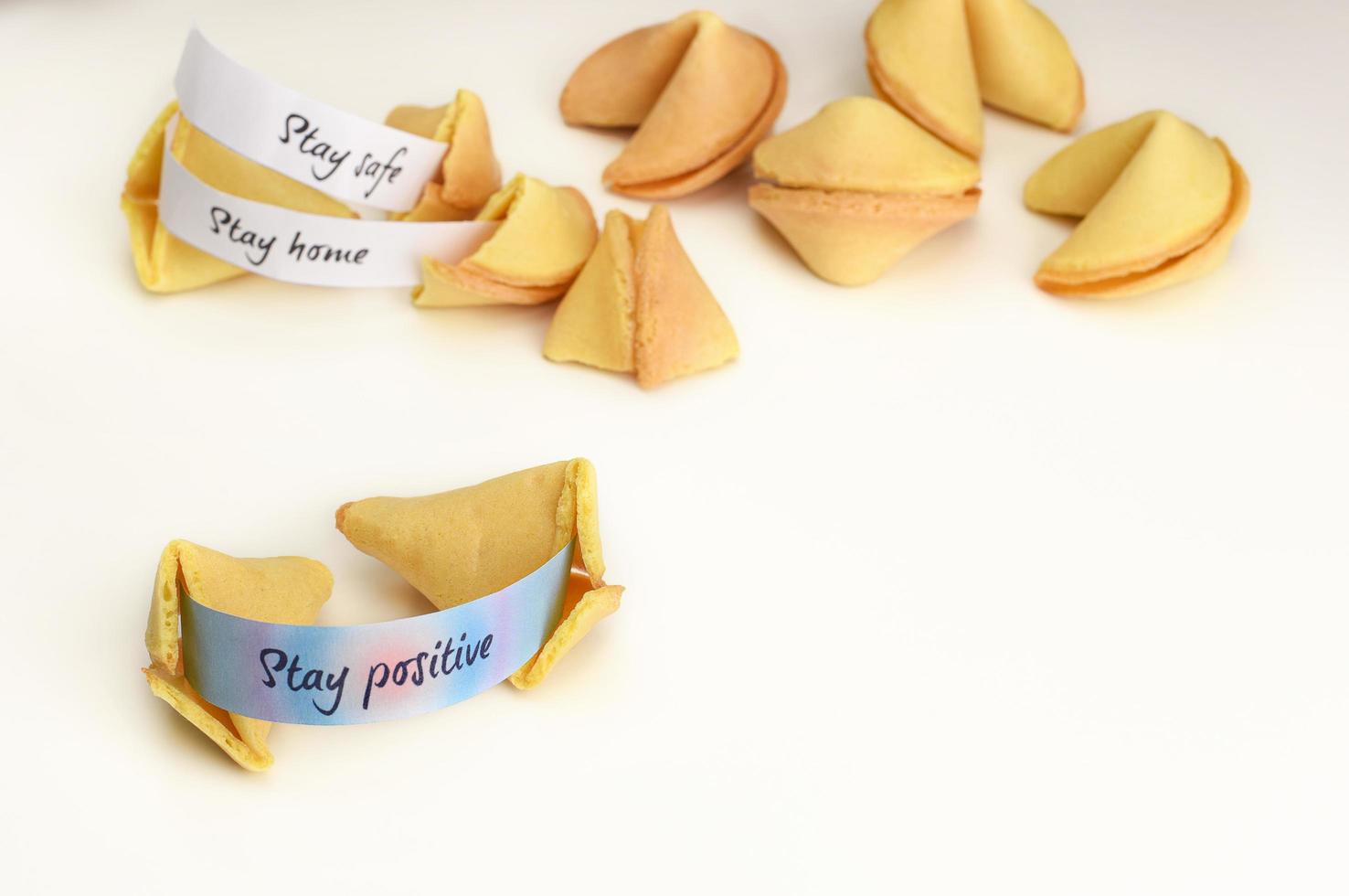 Chinese fortune cookies. An open cookie with a wish Stay Positive. photo