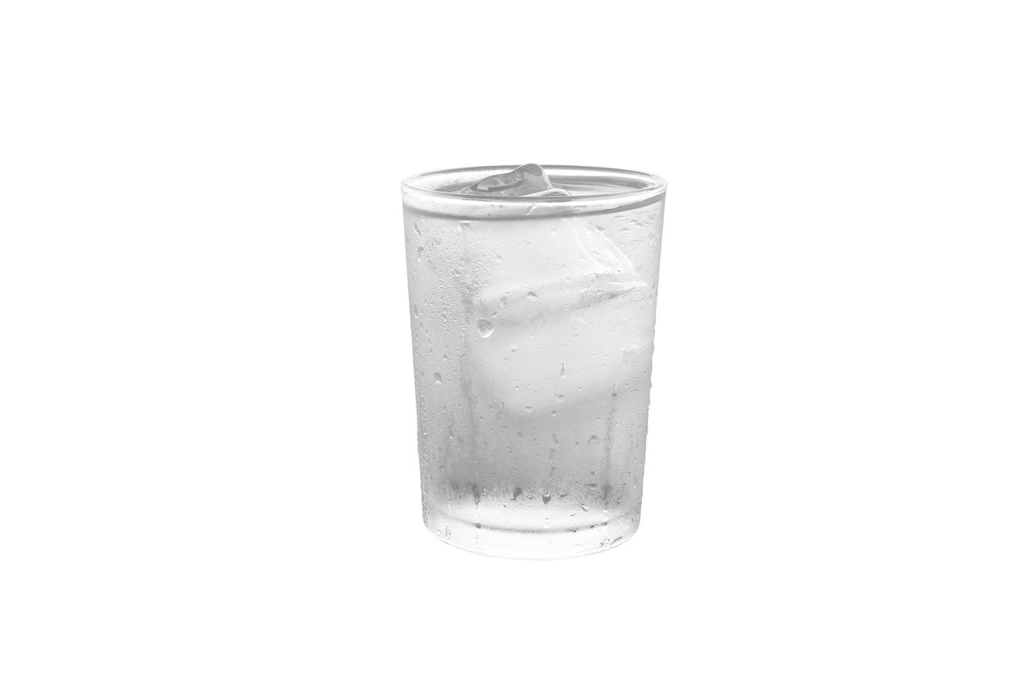 Drinking water with cold ice in glass isolated on white background with clipping path. photo