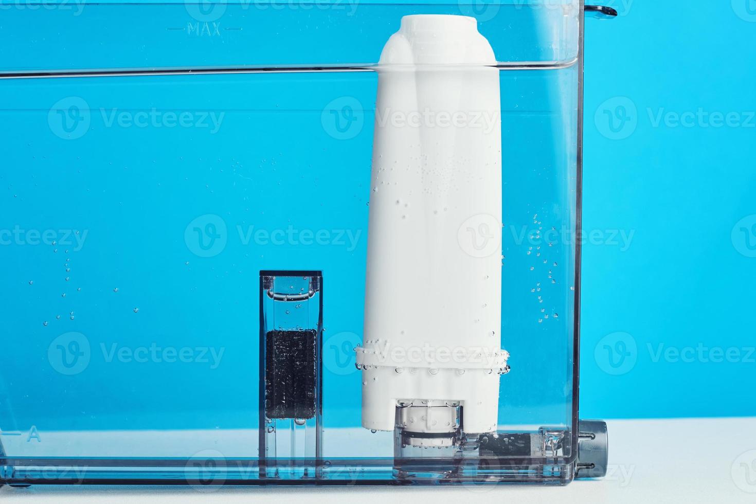 Filter water purification in the coffee machine container. Kitchen appliances photo