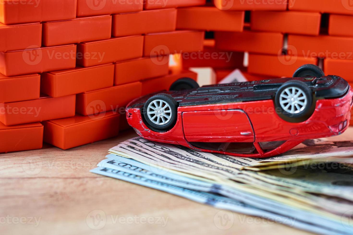 Broken car on a usd banknotes. Car insurance concept photo