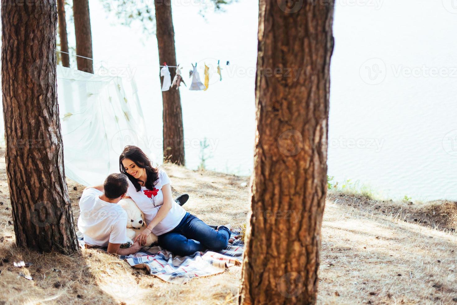 pregnant woman with her husband at a picnic. photo