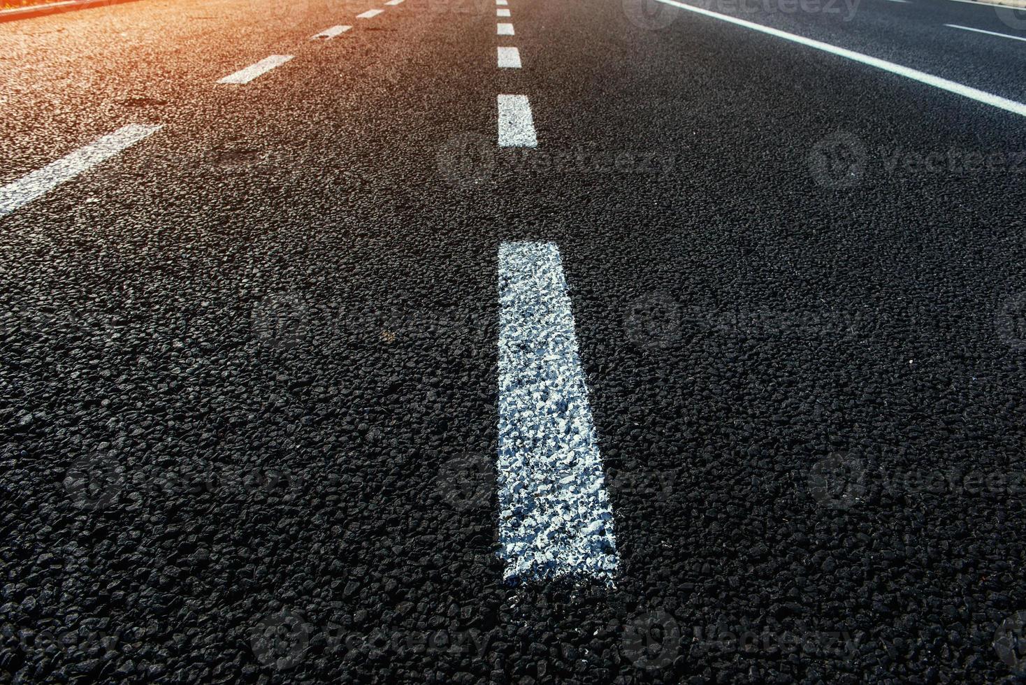 New asphalt texture with white dashed line photo