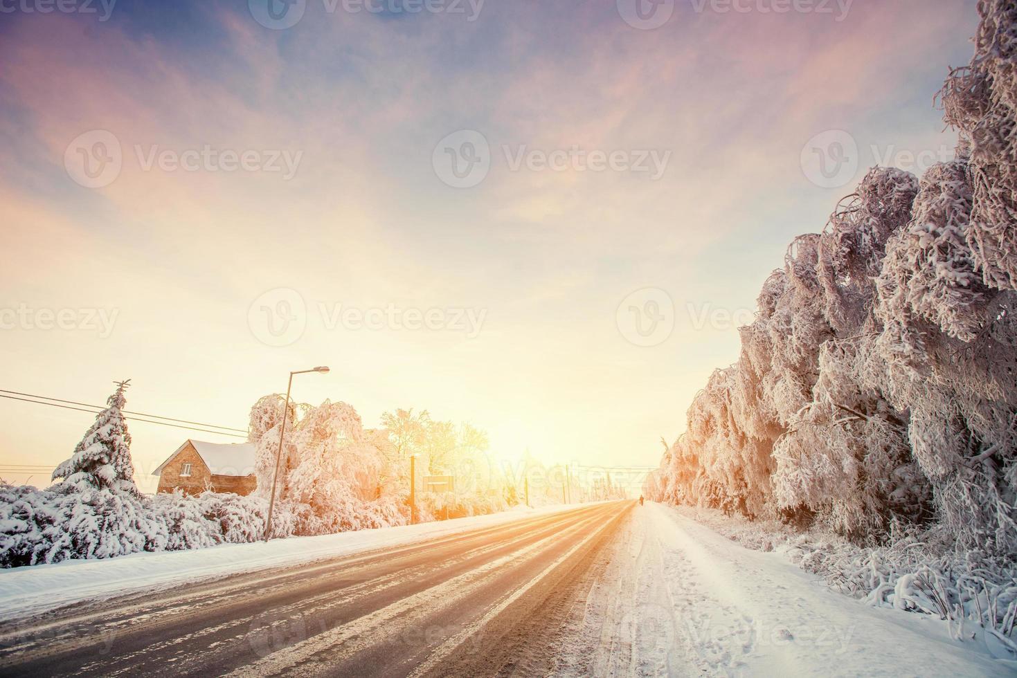 Winter road to the mountain. Sunny frosty january photo