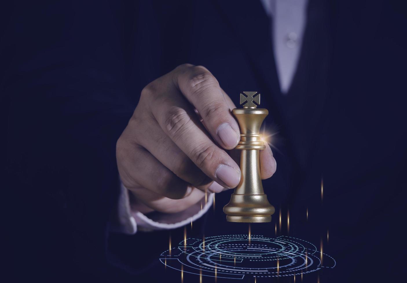 Businessman holding and throwing golden king chess to target for business winner with successfully in the competition with technology network background. Management and leadership strategy concept. photo