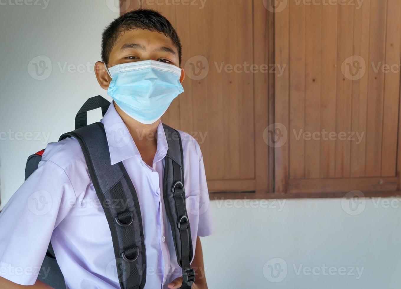 male students wearing masks to prevent virus photo