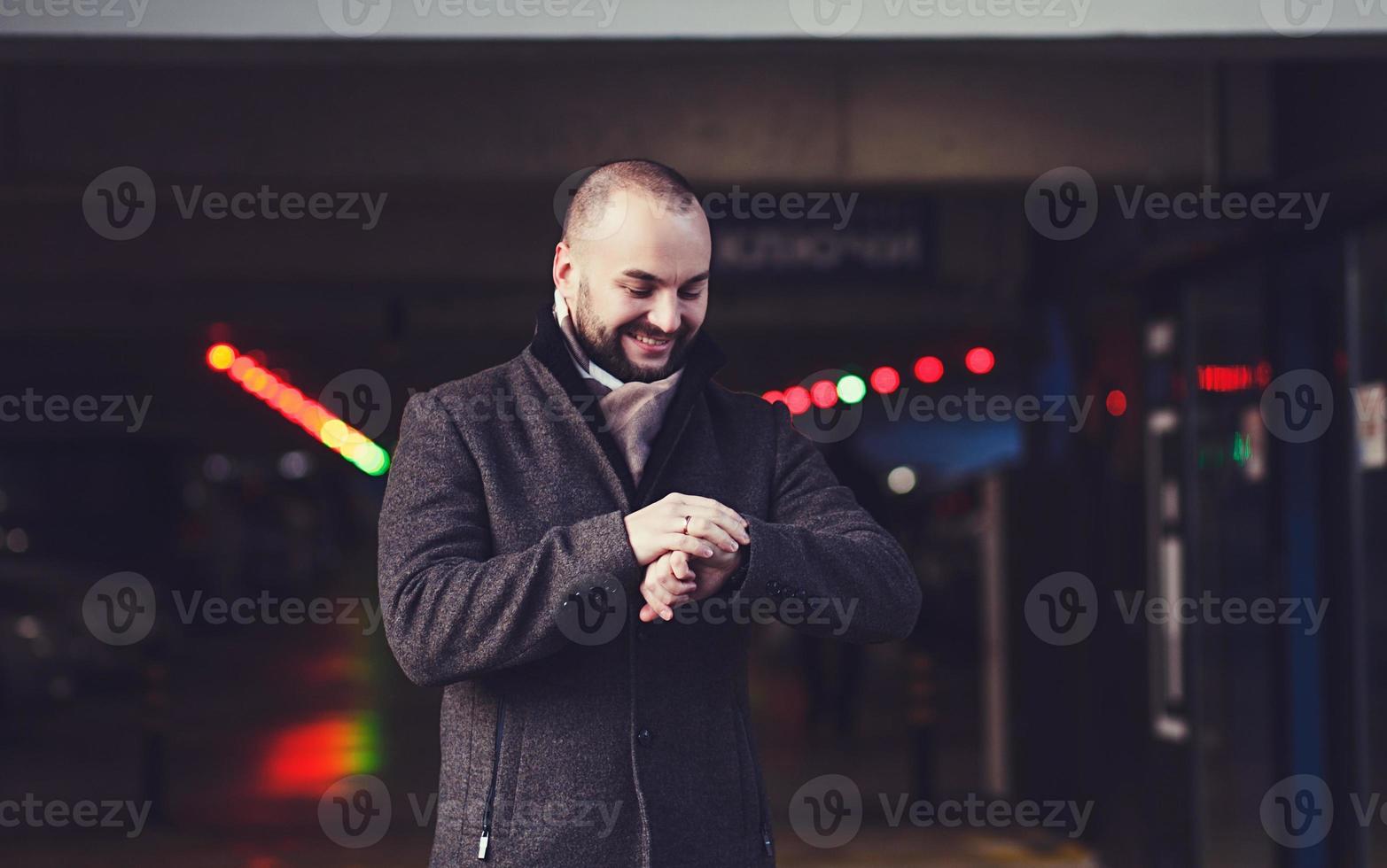 Man in coat with watch photo