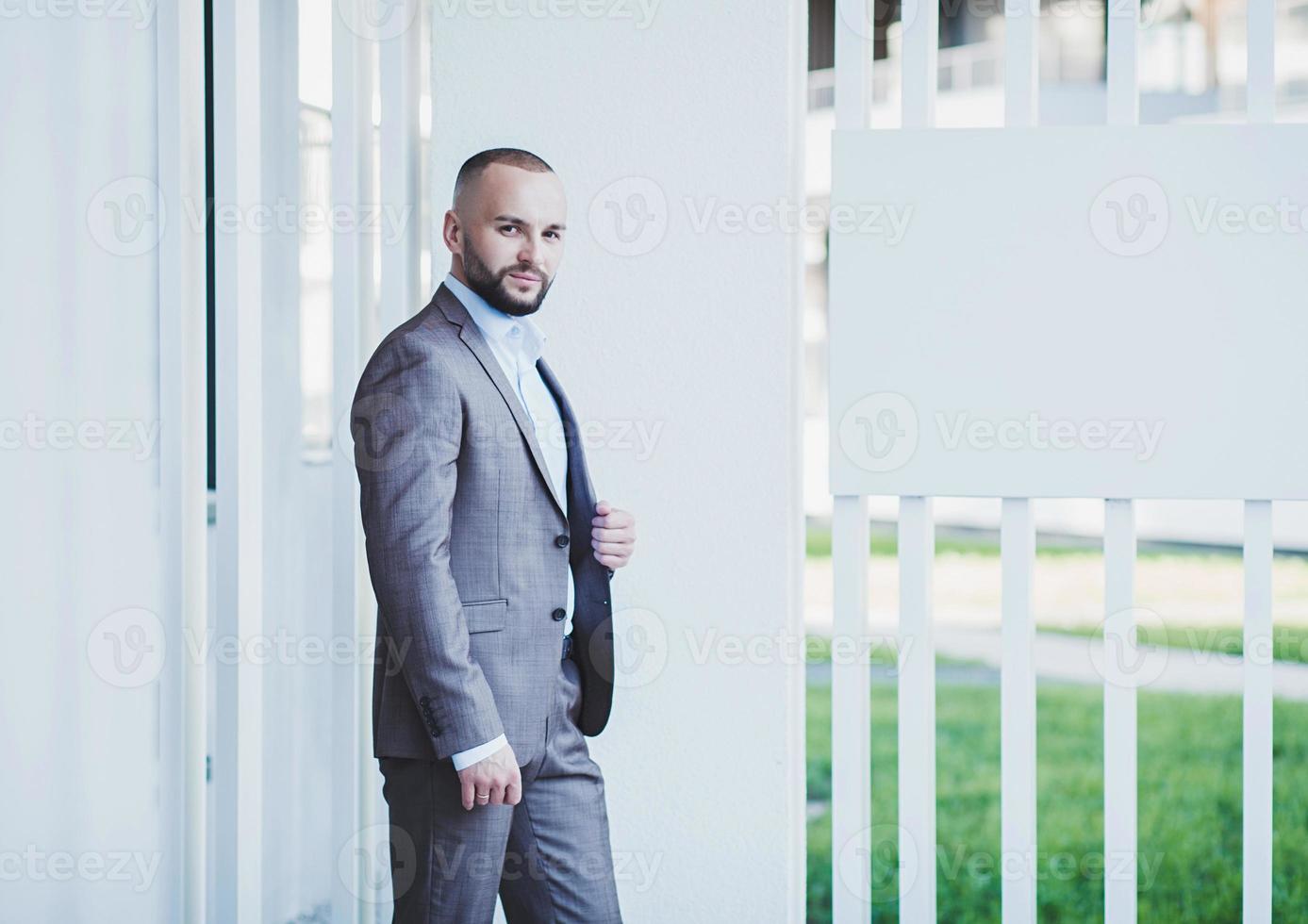 Attractive handsome positive business man photo