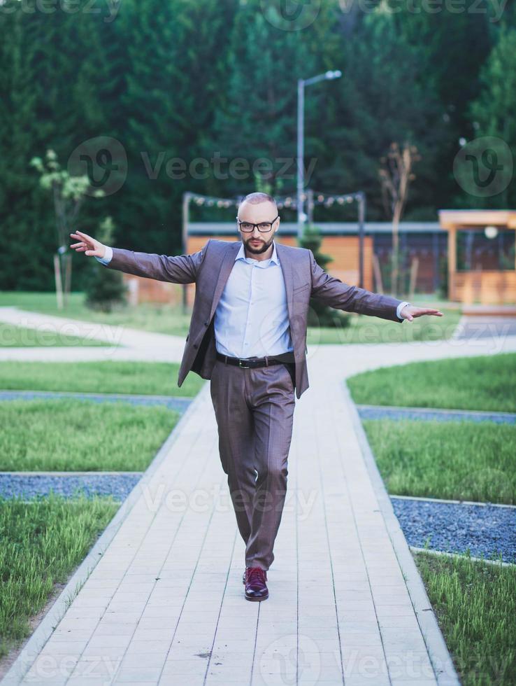 young business man is walking photo