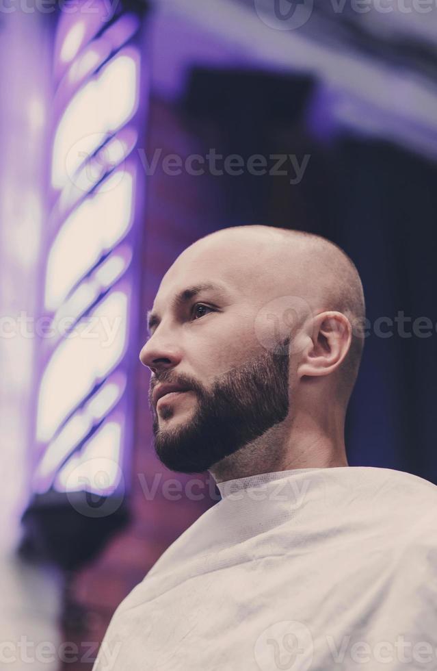 Handsome man in the barbershop. photo