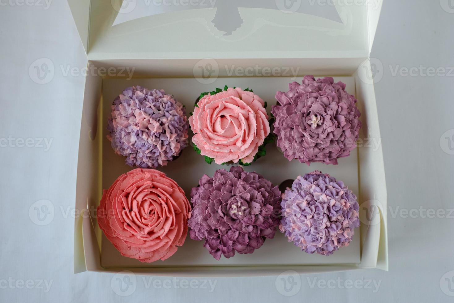 Delicious cupcake on a white plate on a white background. photo