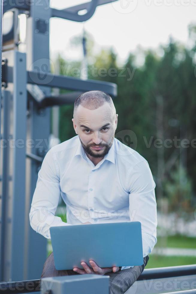 man using a portable computer photo