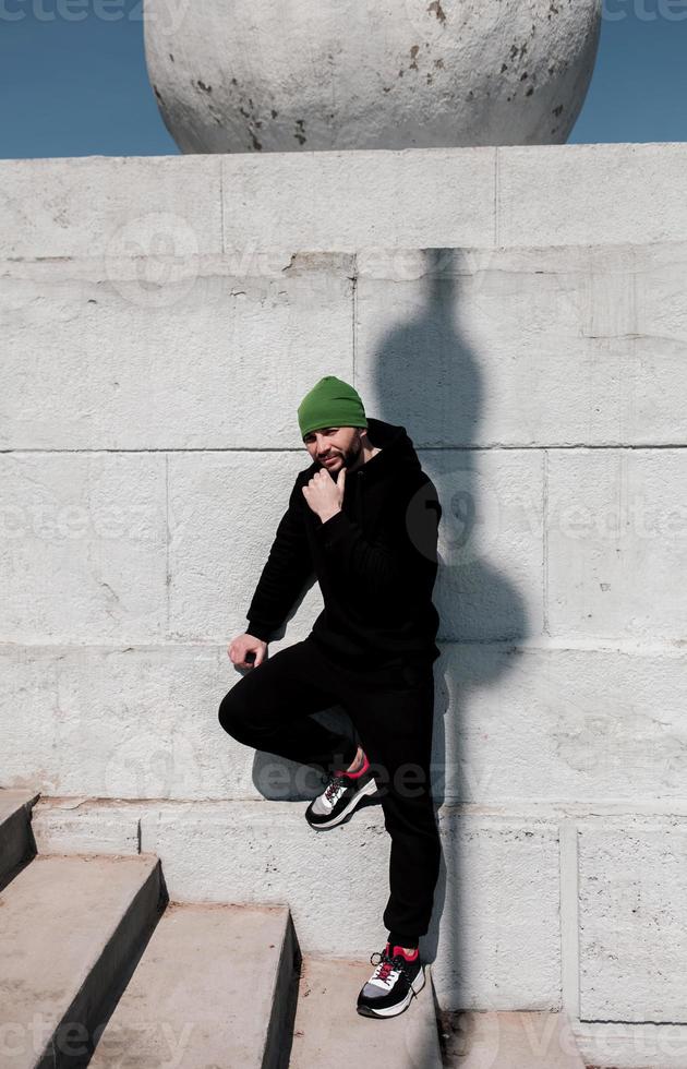 handsome bearded hipster guy wearing black blank hoodie photo