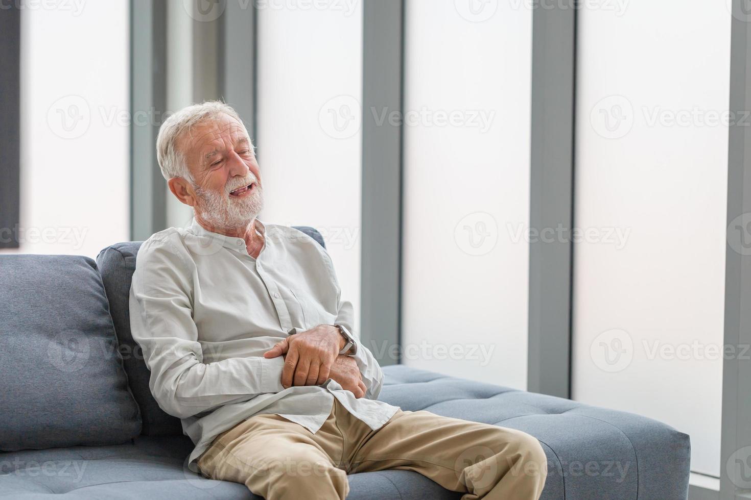 Portrait of happy senior man in living room, Smiling elderly caucasian old man photo