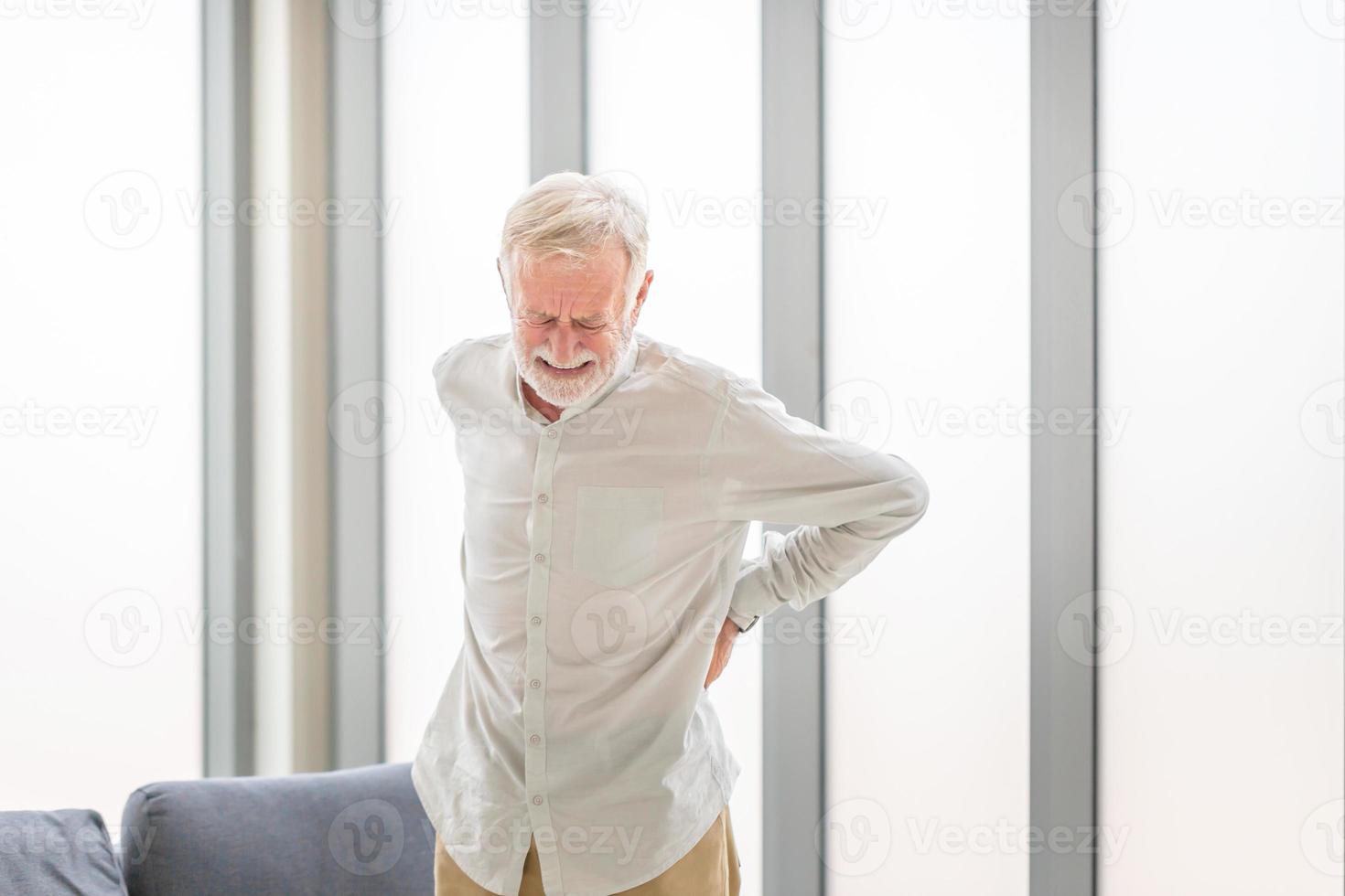 Senior man with back pain, Mature man suffering from low back pain, Old man with back pain photo