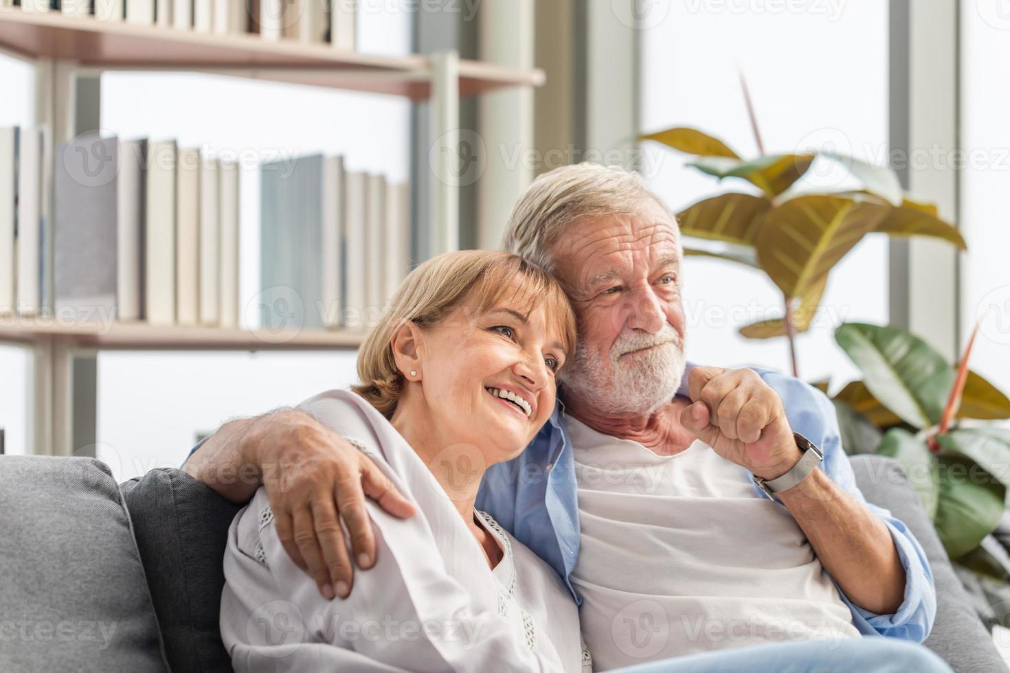 Portrait of happy senior couple in living room, Elderly woman and a man relaxing on cozy sofa at home, Happy family concepts photo