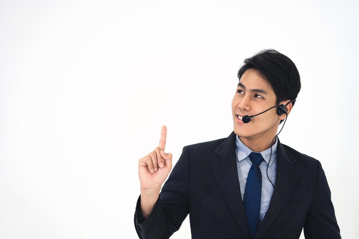 Business man call center. Point hand up to clear background. photo