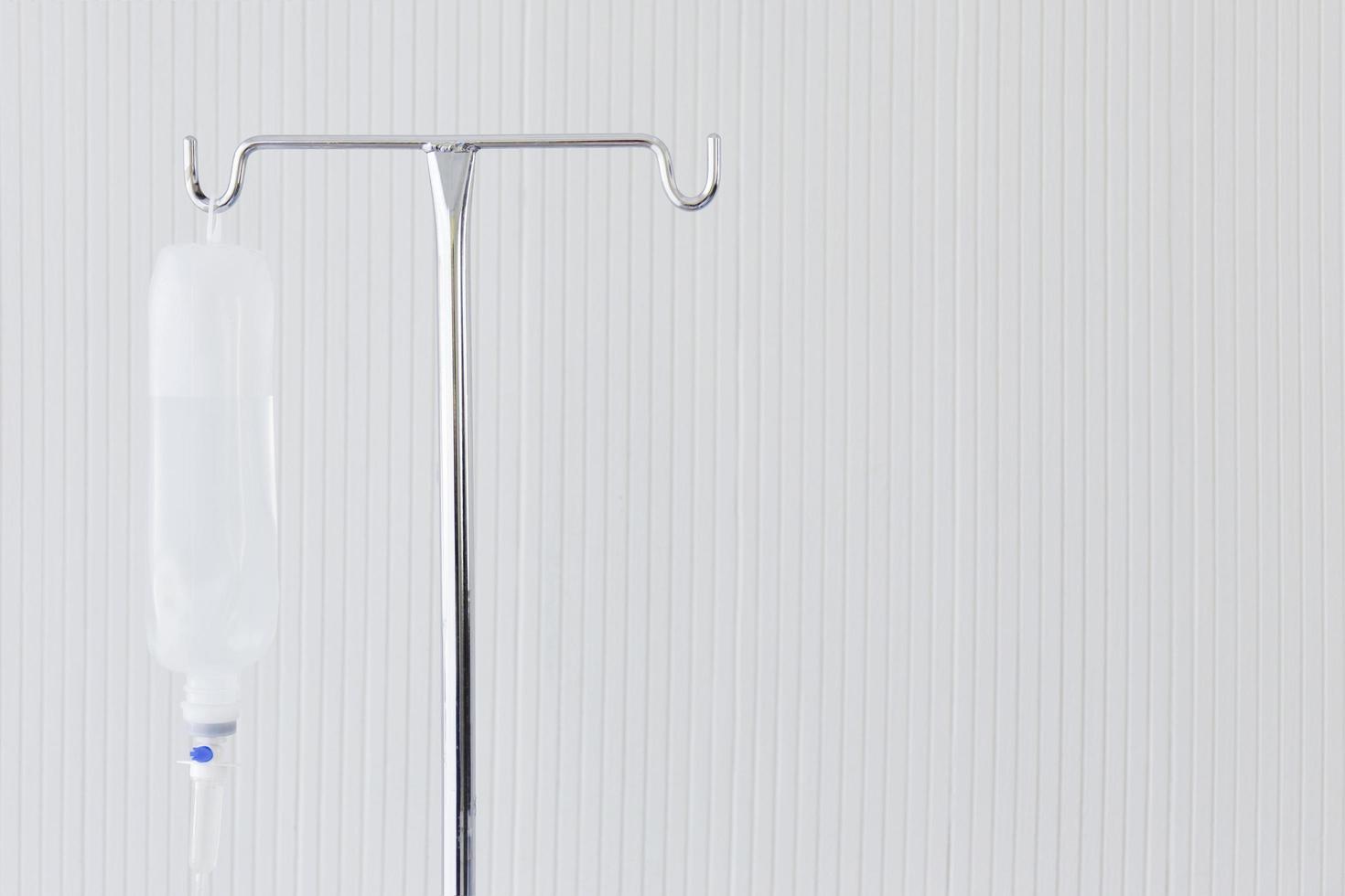 A metal pole that hung a saline bottle photo