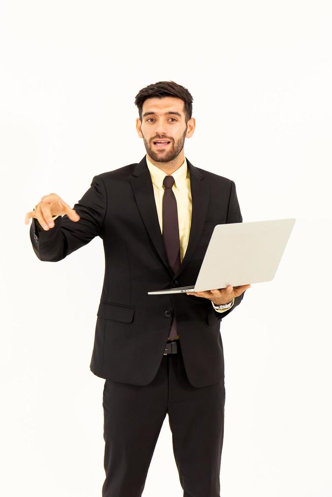 A handsome young man standing on a tablet isolated on white background, photo