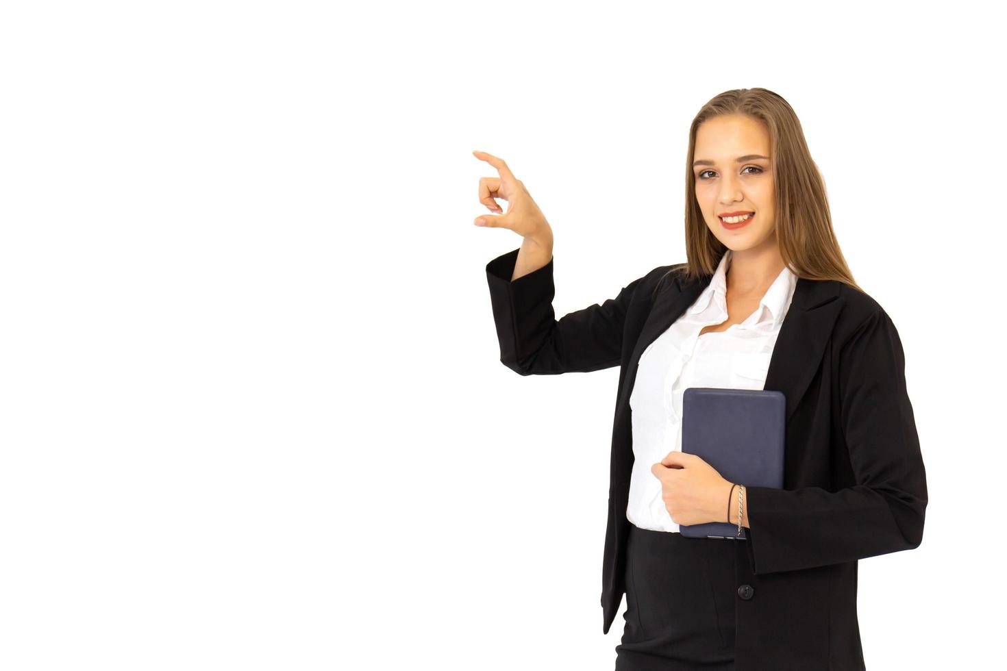 Beautiful young business woman standing on a tablet isolated on white background, photo