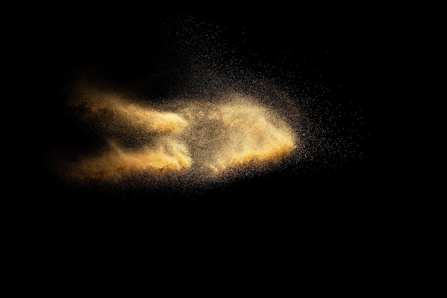 Abstract cloud motion blurred sand background.Sandy explosion isolated on over dark background. photo