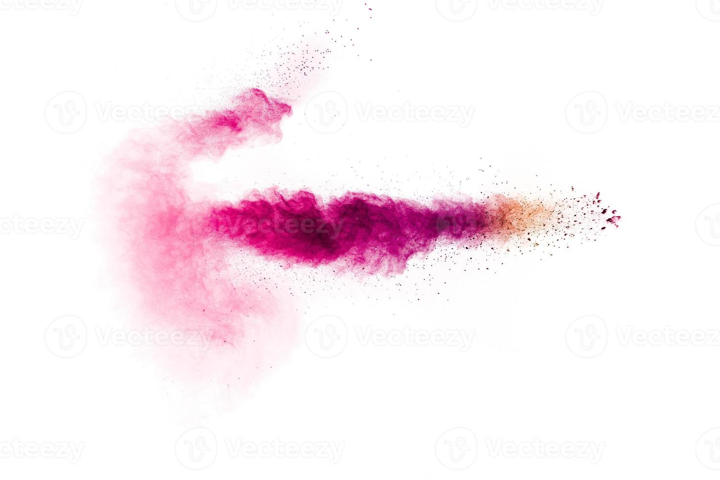 explosión de polvo rosa sobre fondo blanco. nube de salpicaduras de polvo rosa. partículas de colores lanzadas. foto