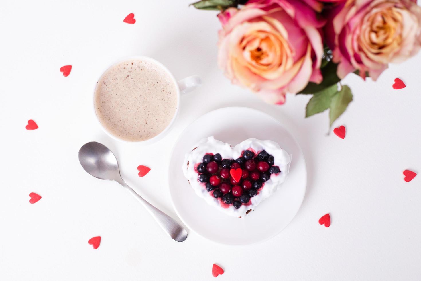 Heart shaped cake decorated with red currant photo