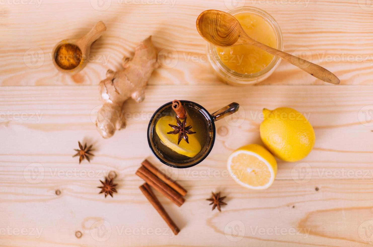 Cup warm water with lemon, honey and ginger root. photo