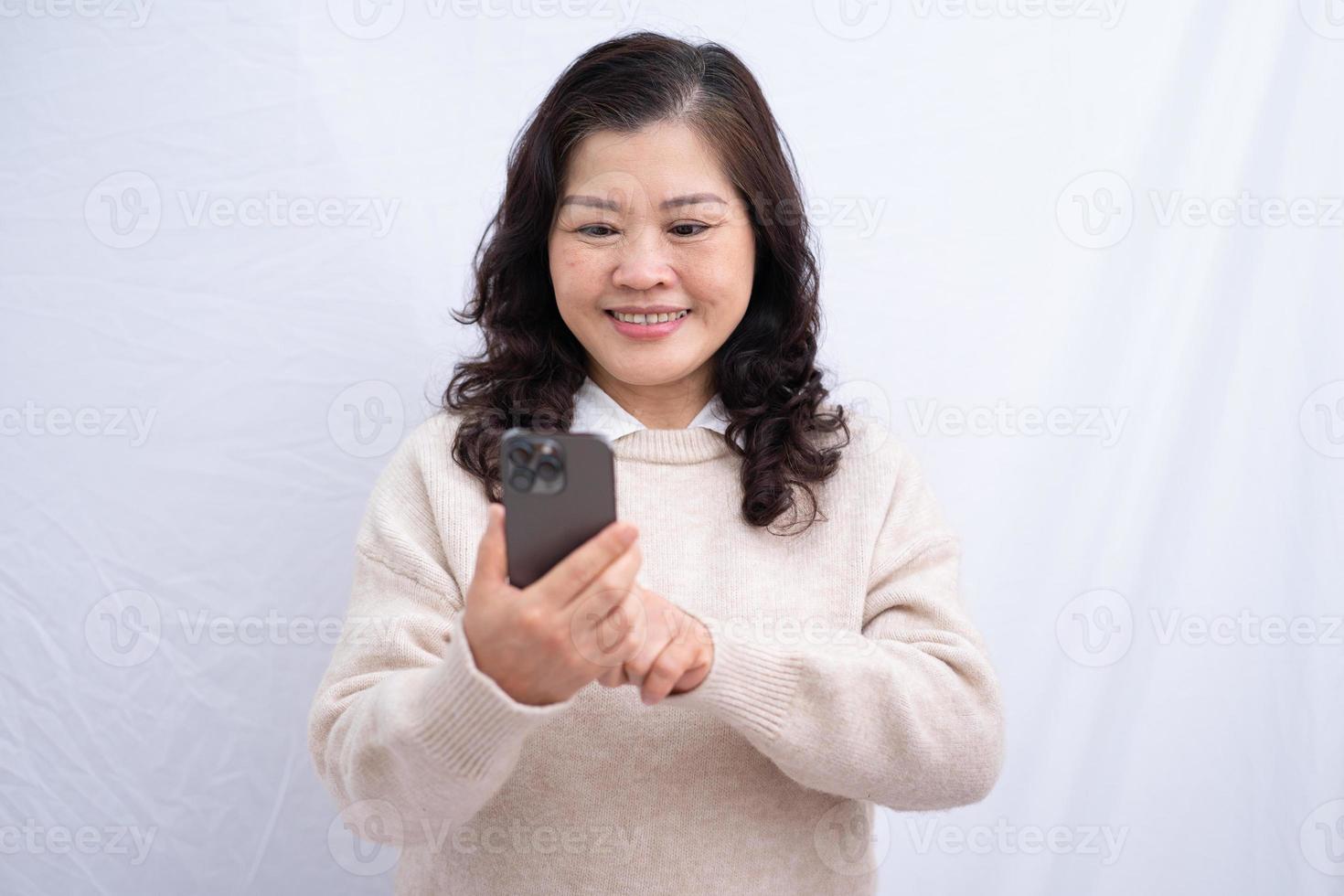 Portrait of senior Asian woman on white background photo