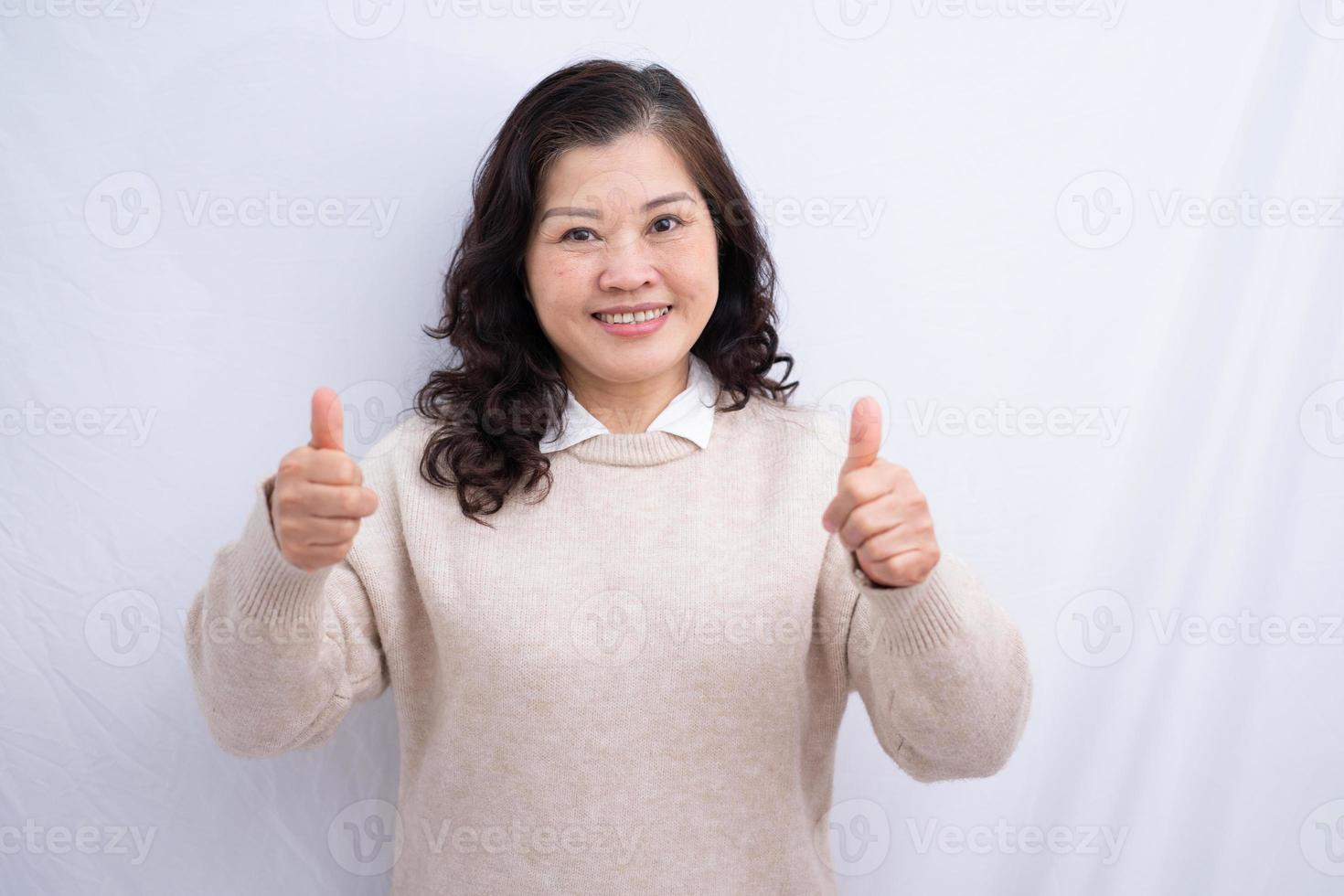 Portrait of senior Asian woman on white background photo