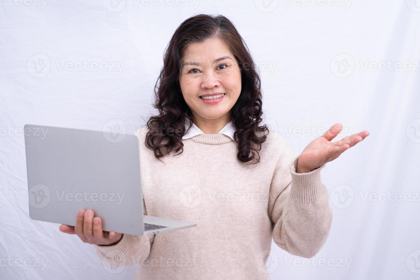 Portrait of senior Asian woman on white background photo