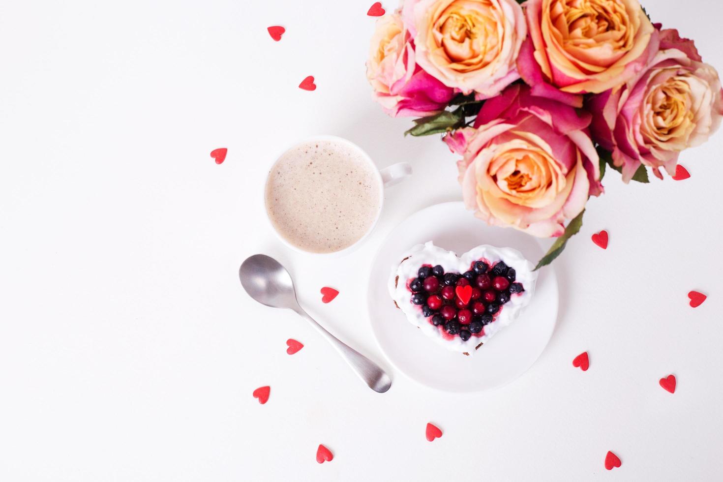 Heart shaped cake decorated with red currant photo