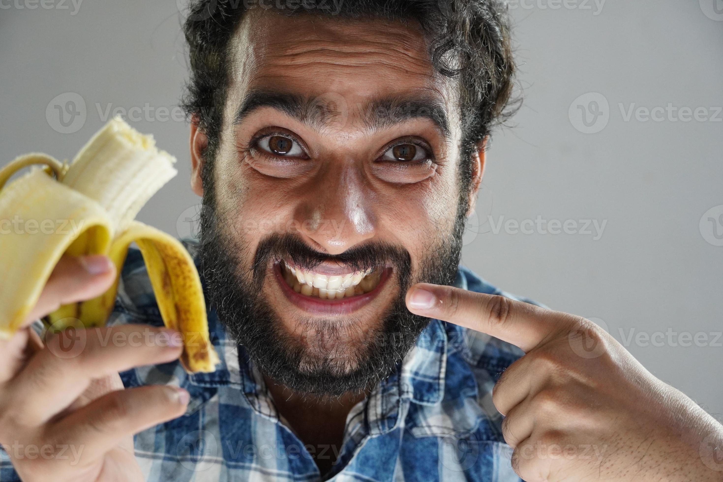 Man Eating Banana And Showing Teeth 6856469 Stock Photo At Vecteezy man-eating-banana-and-showing-teeth-6856469-stock-photo-at-vecteezy