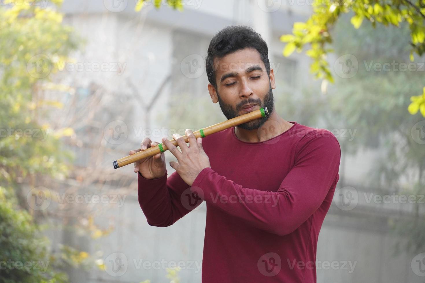 Man Playing Flute - Indian Musical Instrument photo