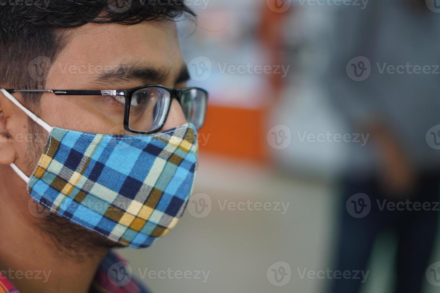 a man in wearing mask due to Covid photo