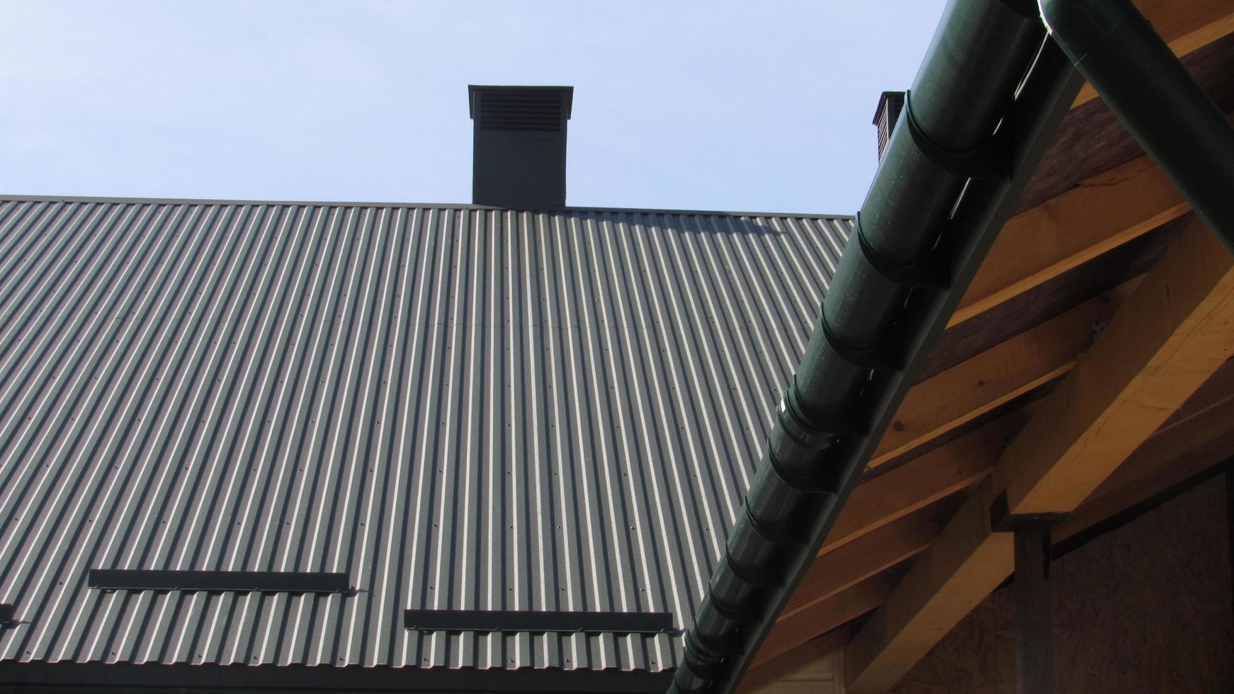 roofing. metal profile. replacement of coating for the house. roof repair photo