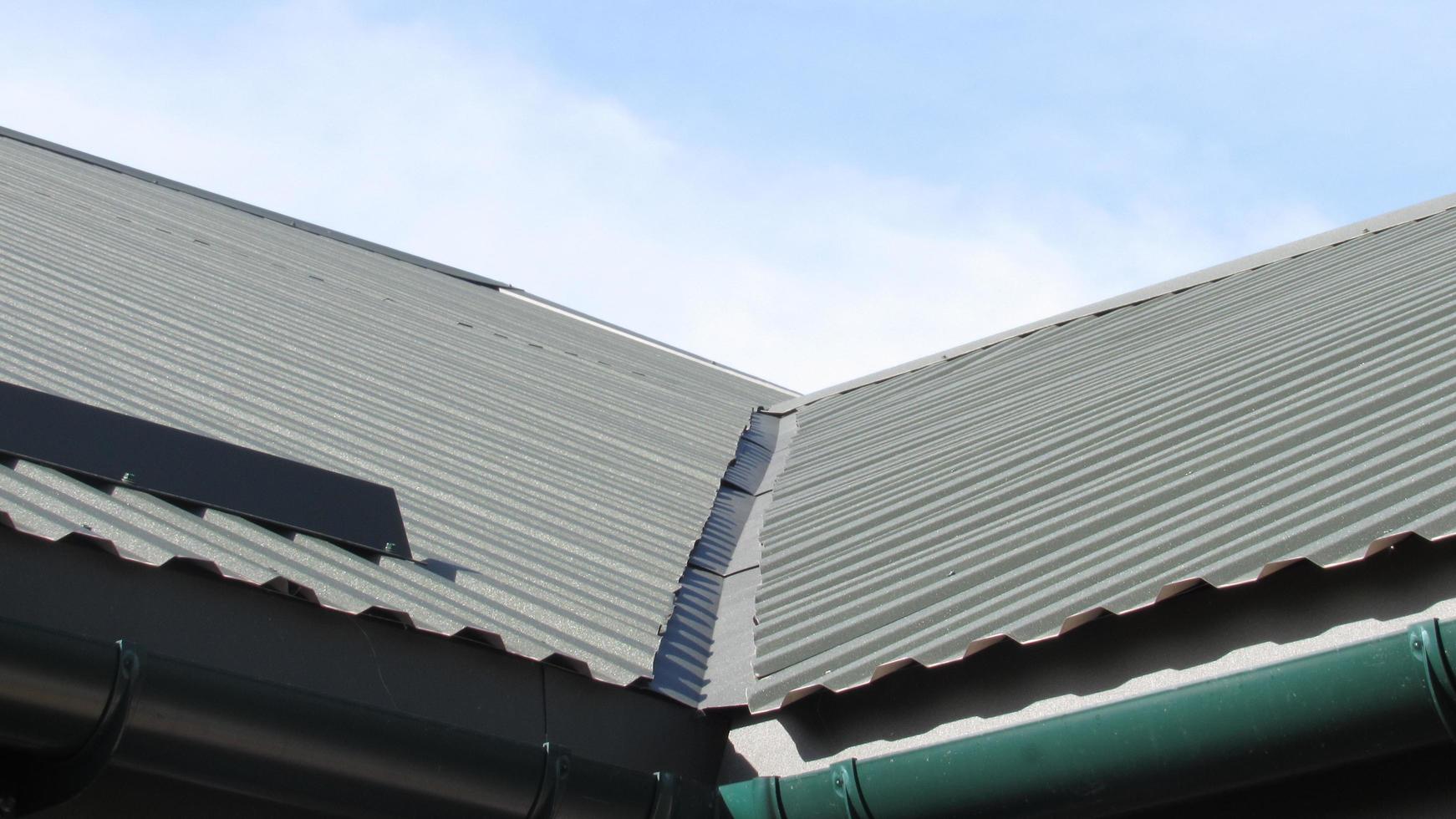 roofing. metal profile. replacement of coating for the house. roof repair photo