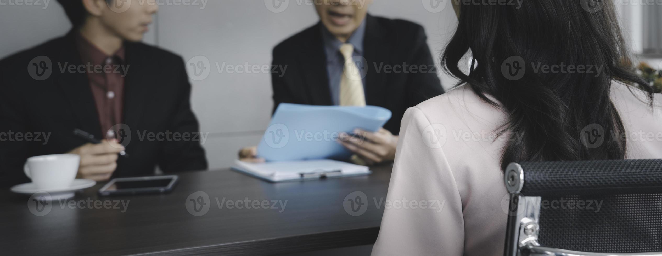 HR staff and manager interviewing candidate at office photo