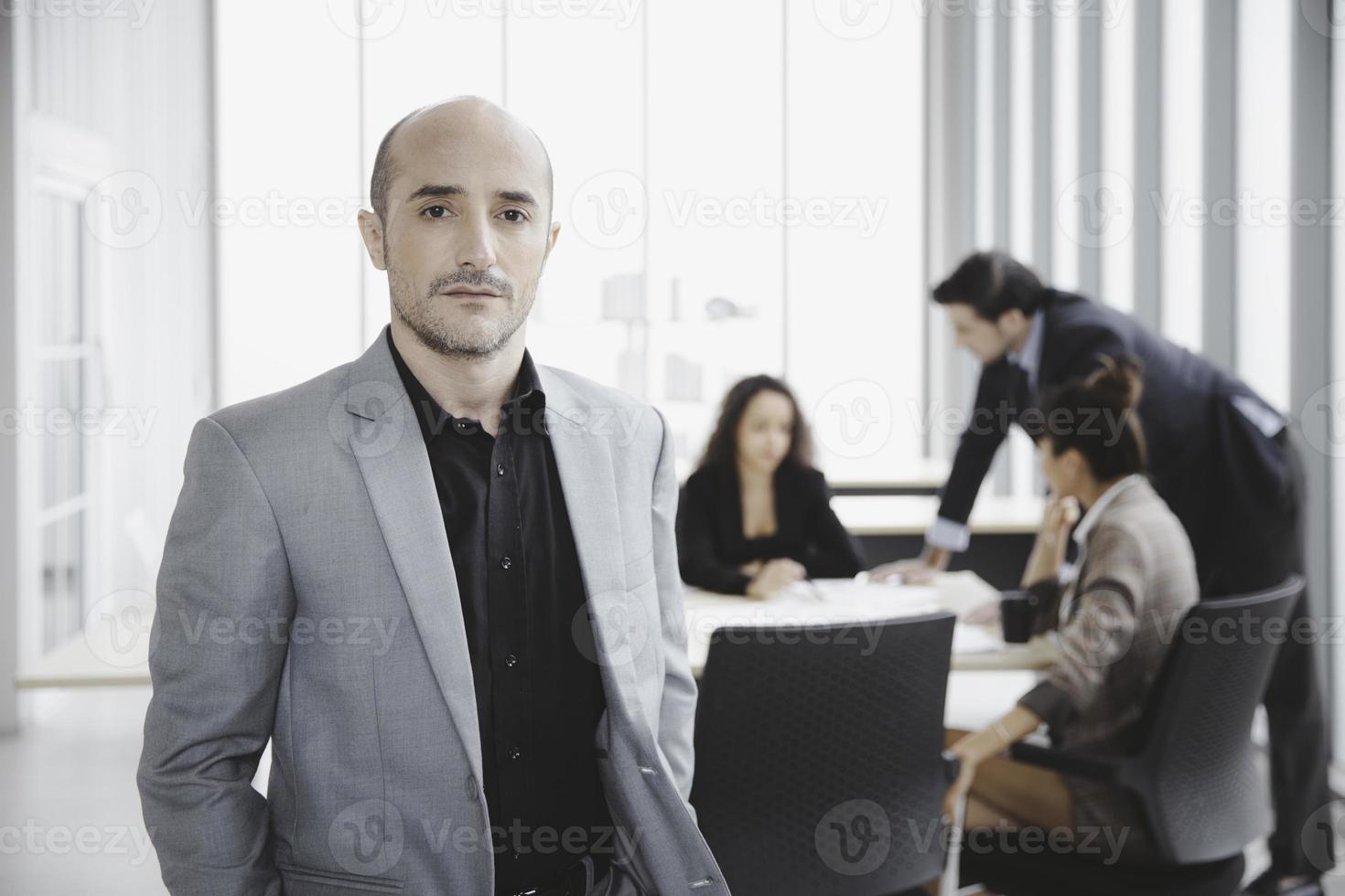 Portrait of confidence businessman with colleague in modern office in modern office photo