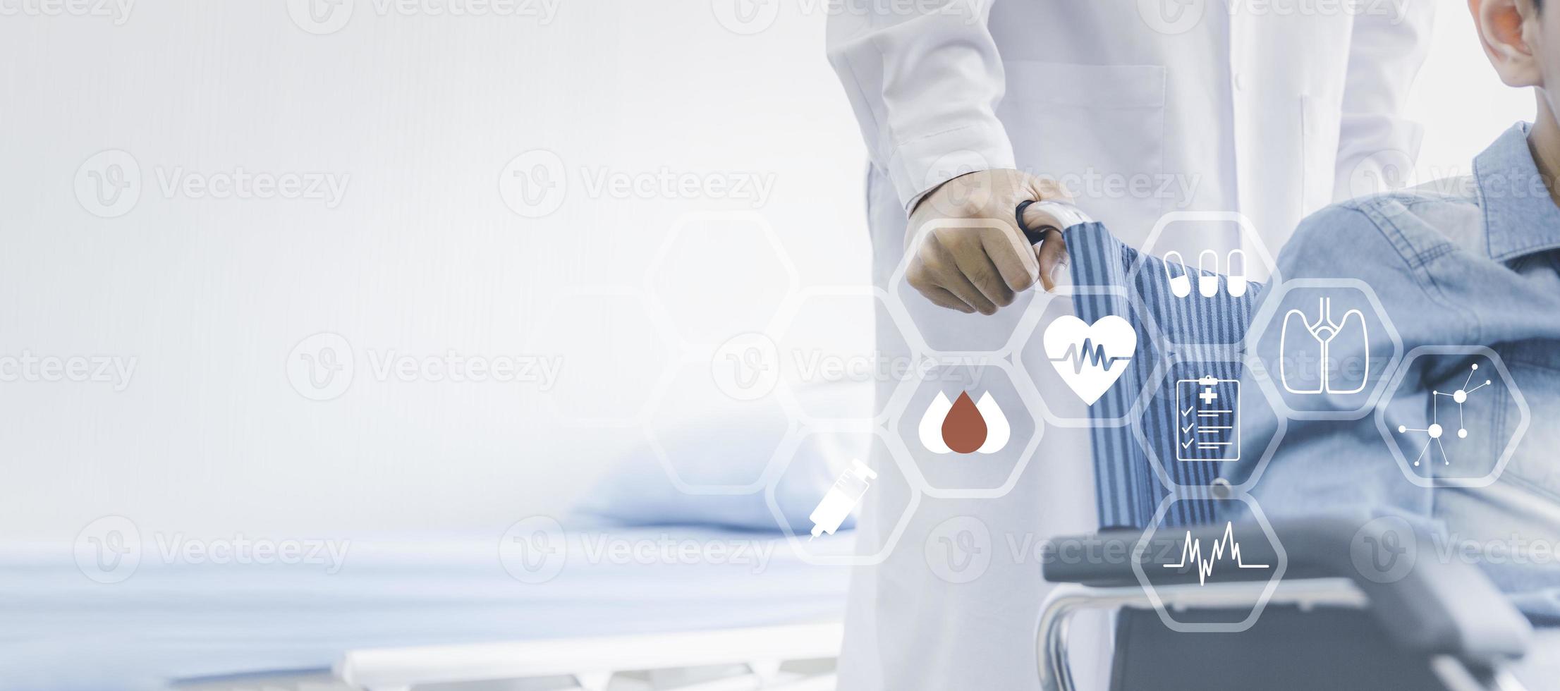 Healthcare or insurance concept with infographic and copy space, Closeup doctor hand with patient on wheelchair photo