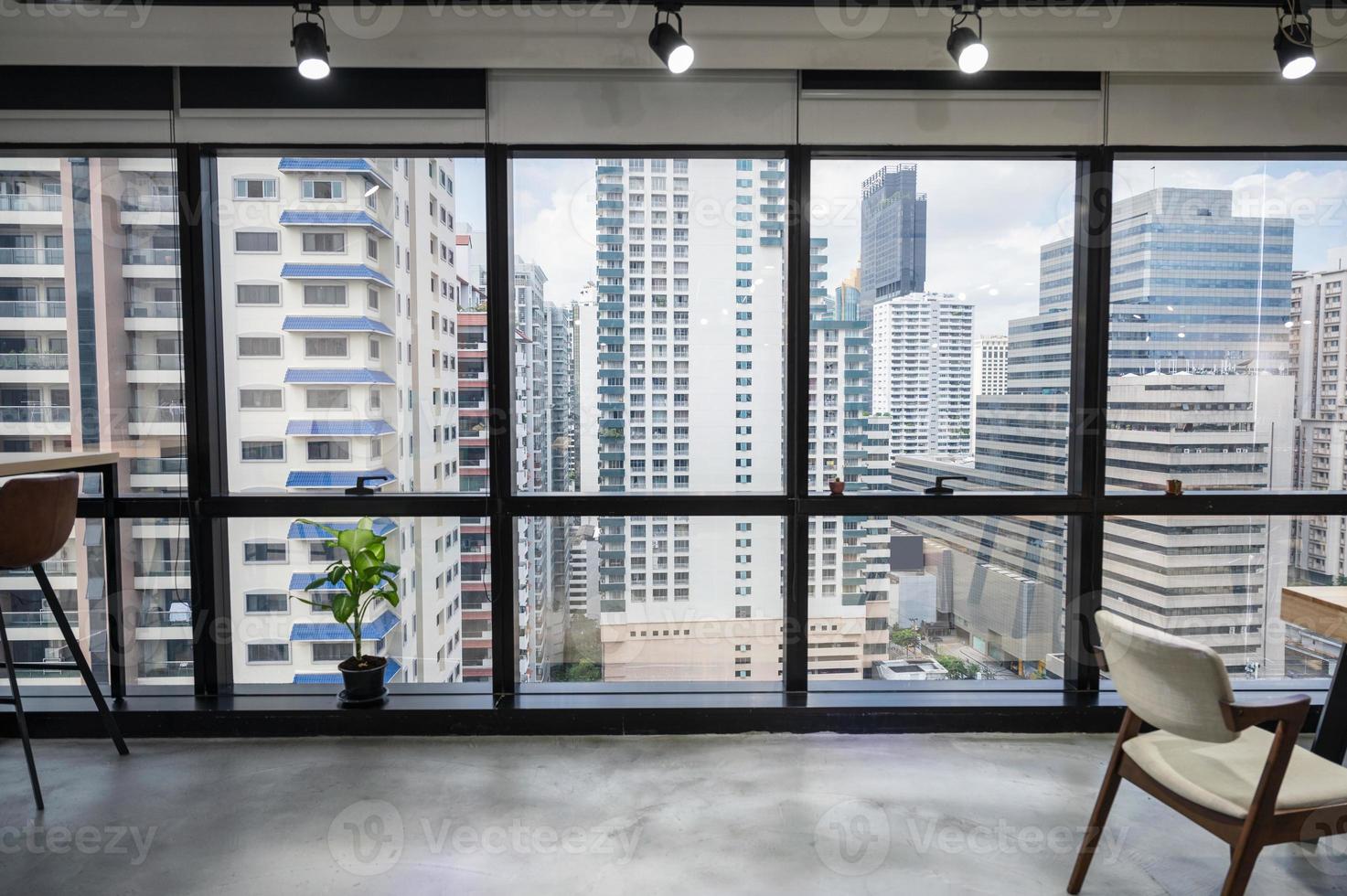 Cityscape of business office in downtown from empty coworking space temporarily closed photo