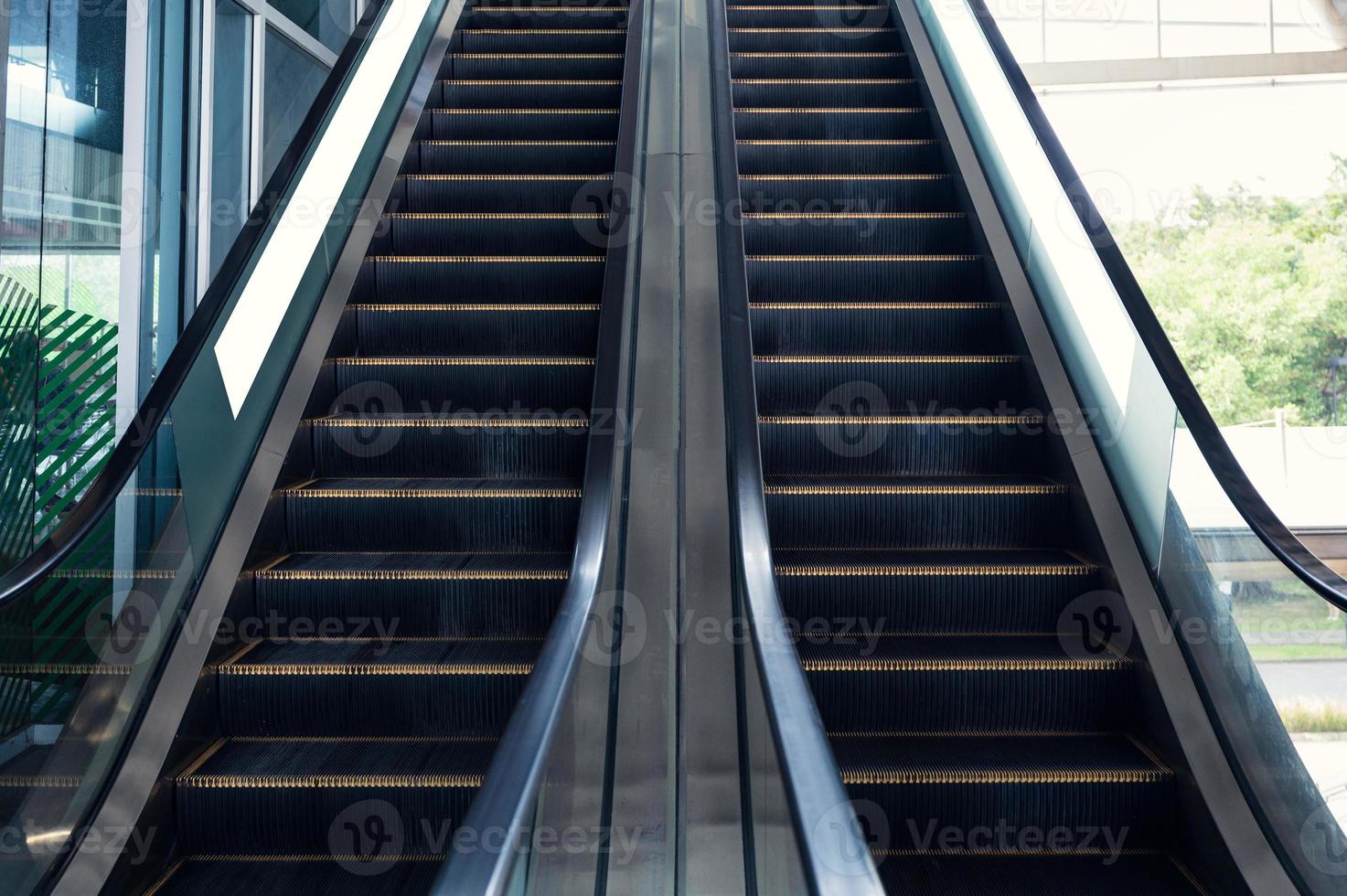 Electric escalators with railing moving up and down photo