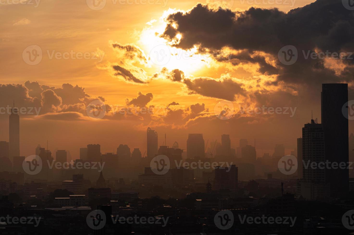 Sunrise over Bangkok city with high buildings in downtown photo