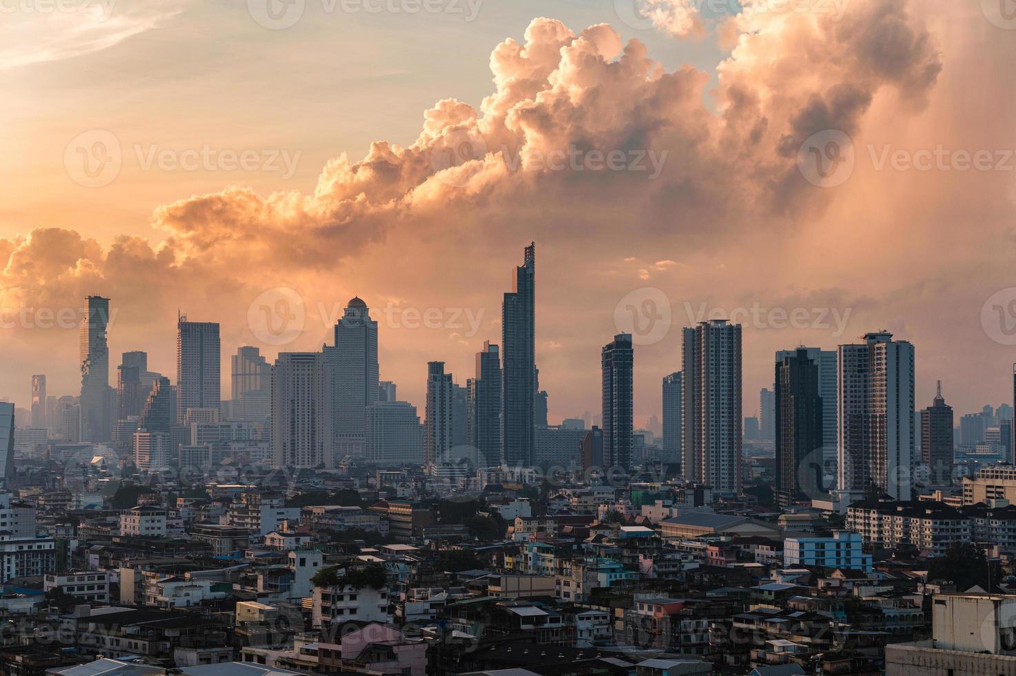 High-rise building in central business district with colorful dramatic sky in Bangkok city photo